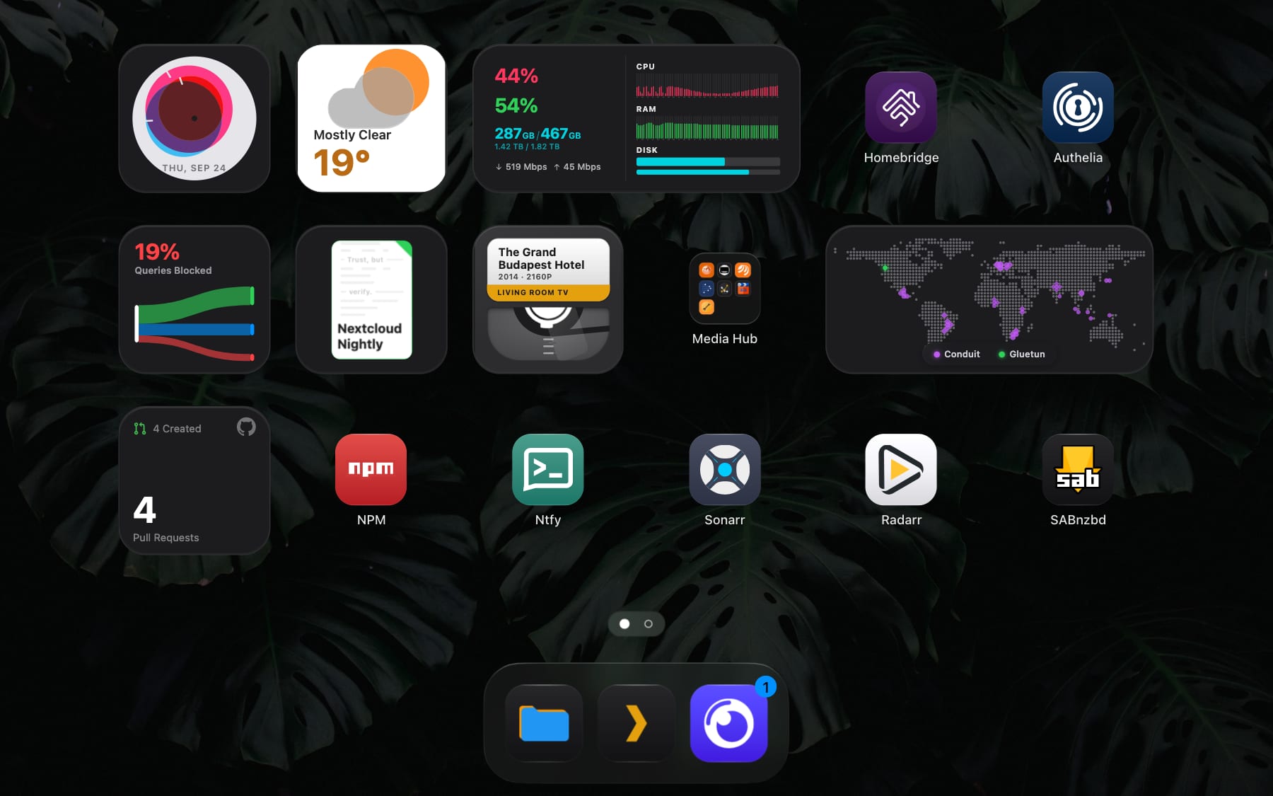 The Stackyard dashboard, with widgets, app tiles, two folders and the dock.